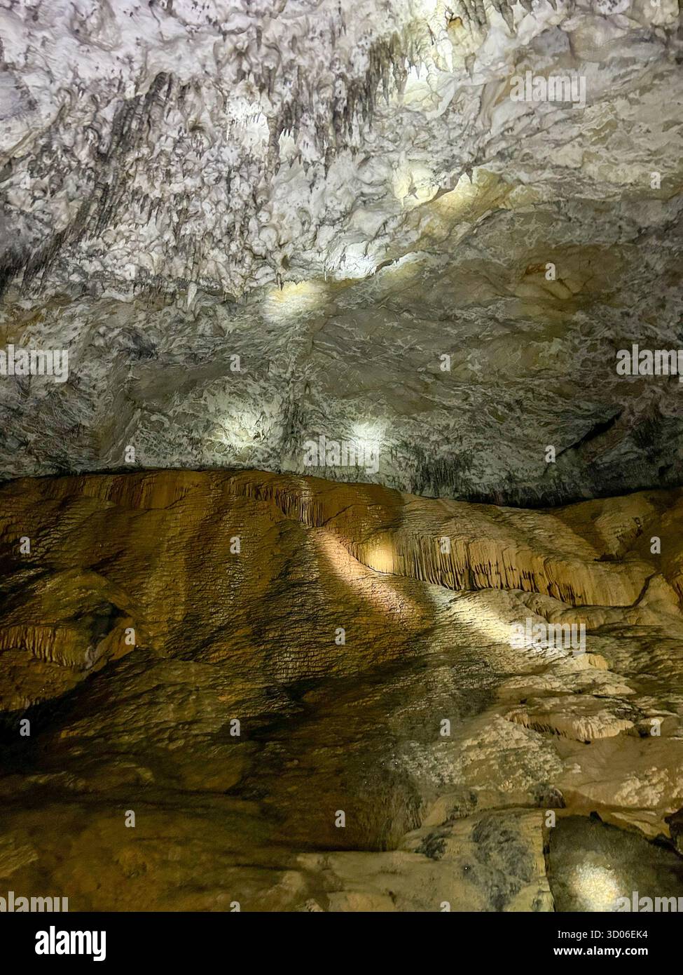 Beautiful limestone formations inside the Ice Cave in Uvac Canyon, Serbia, showcasing natural textures and light reflections on the cave walls. - Smartphone Captured Stock Image