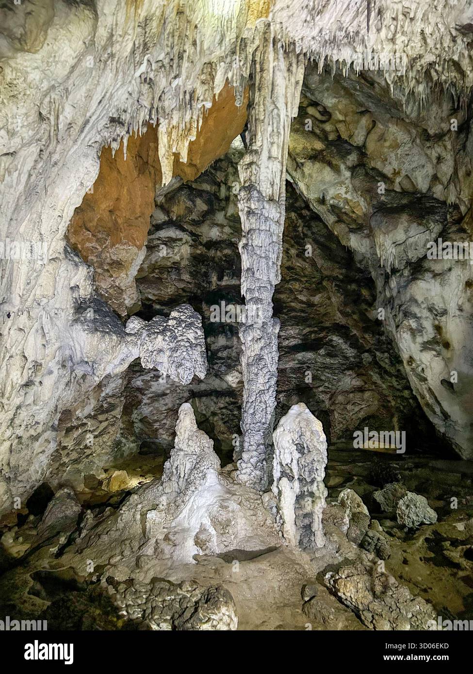 Impressive limestone columns, stalactites, and stalagmites inside the Ice Cave of Uvac Canyon, Serbia, showcasing the beauty of natural underground fo - Smartphone Captured Stock Image