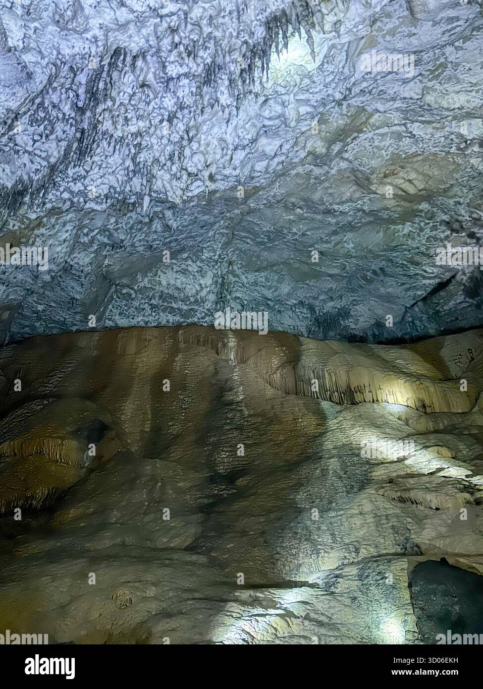 Magnificent rock formations and icy textures inside the Ice Cave of Uvac Canyon, Serbia, illuminated by soft light revealing natural limestone details - Smartphone Captured Stock Image