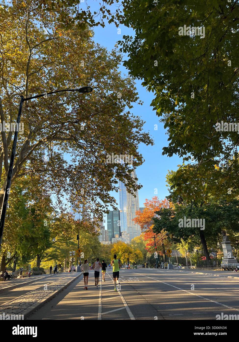 Runners in Central Park, NYC, full of energy and city spirit. - Smartphone Captured Stock Image