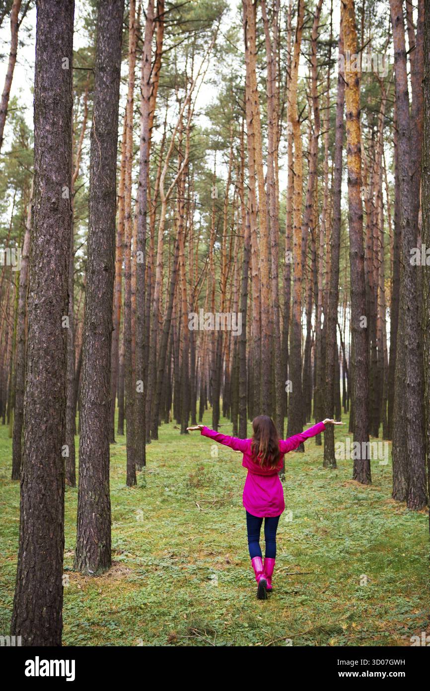 Girl walking alone in forest hi-res stock photography and images - Alamy