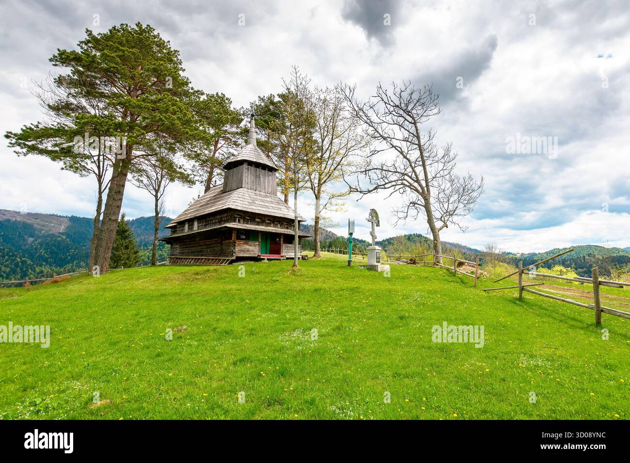 kuzhbeyi, ukraine - 12 may 2019: old wooden church on a hill in abandoned village of transcarpathia region, mizhhirya district. historic lemko archite Stock Photo