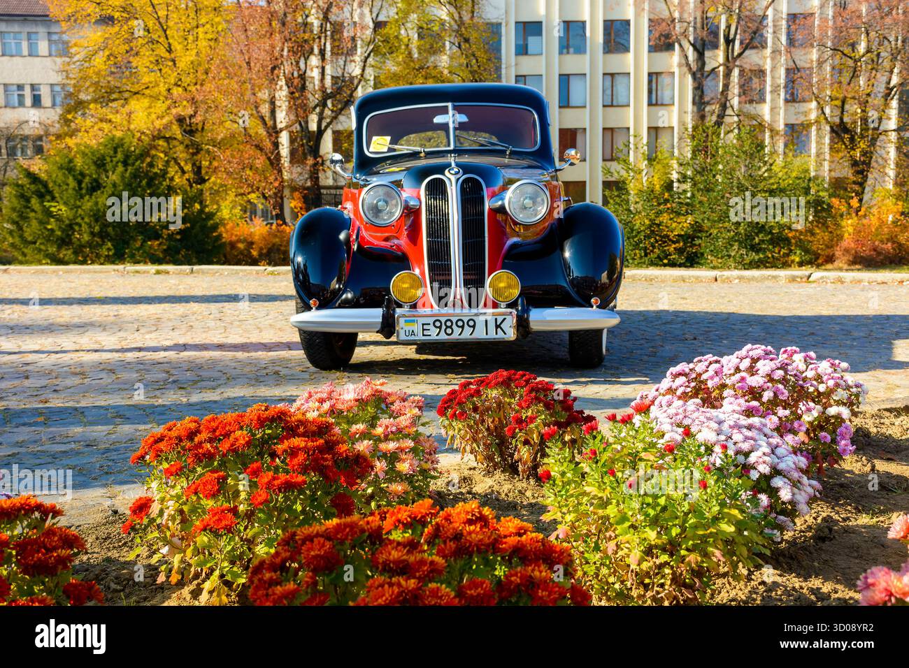 uzhhorod, ukraine - 31 oct, 2021: front view of a red bmw 321 with black hood. classic oldtimer from 40s. vintage vehicle exhibition on narodna square Stock Photo