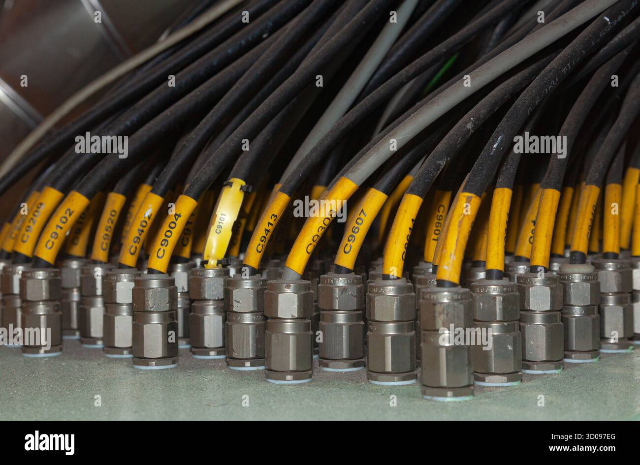 Several powerful electrical cables connected to a junction box Stock Photo