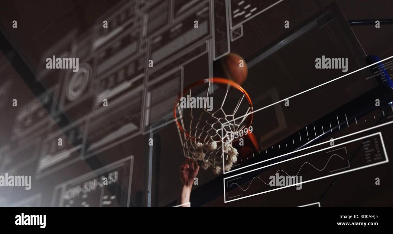 Leaping basketball athlete gripping rim and dunking ball on court ...