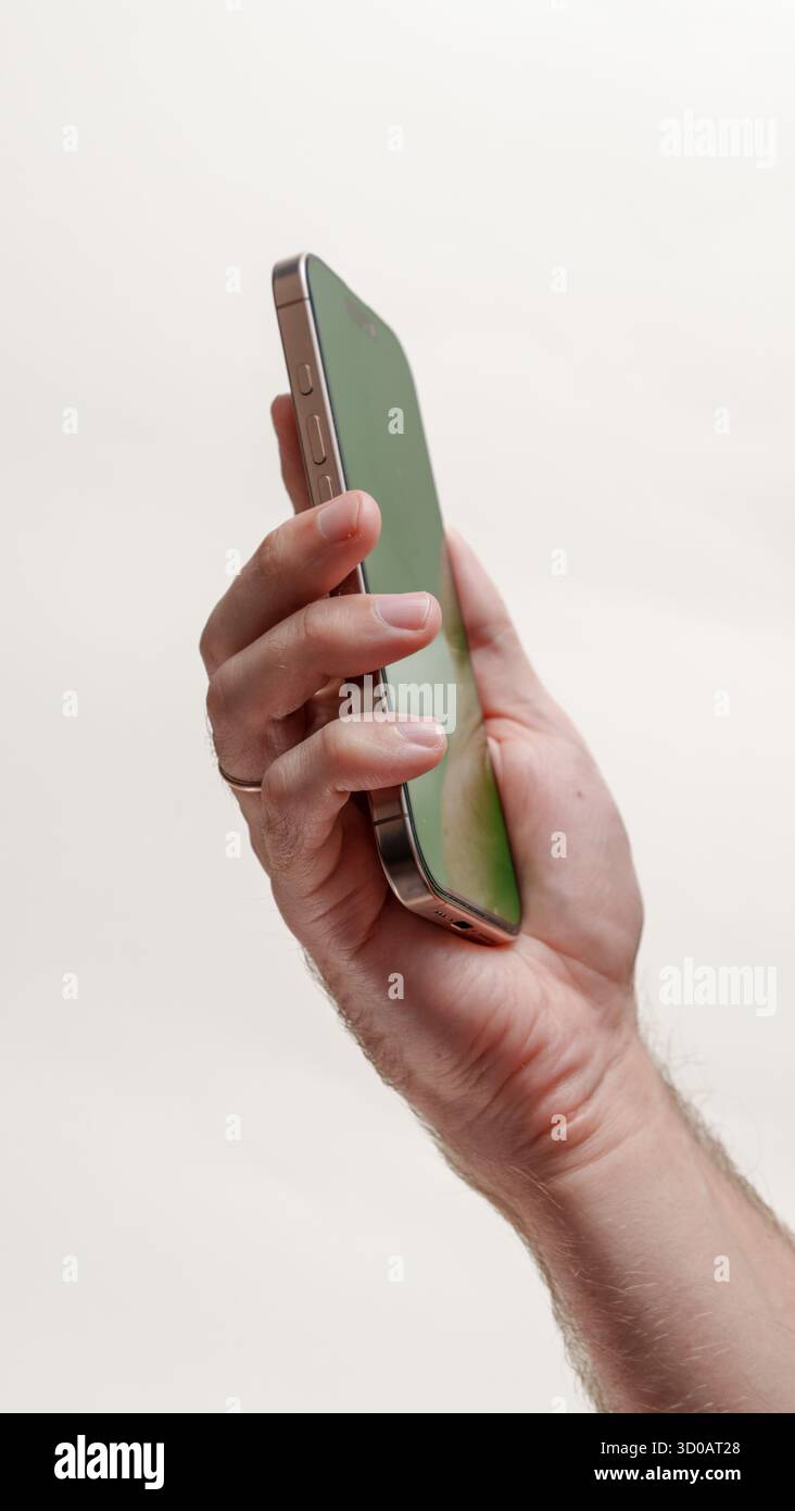 Digital Template: Green Screen Smartphone in Hands Stock Photo