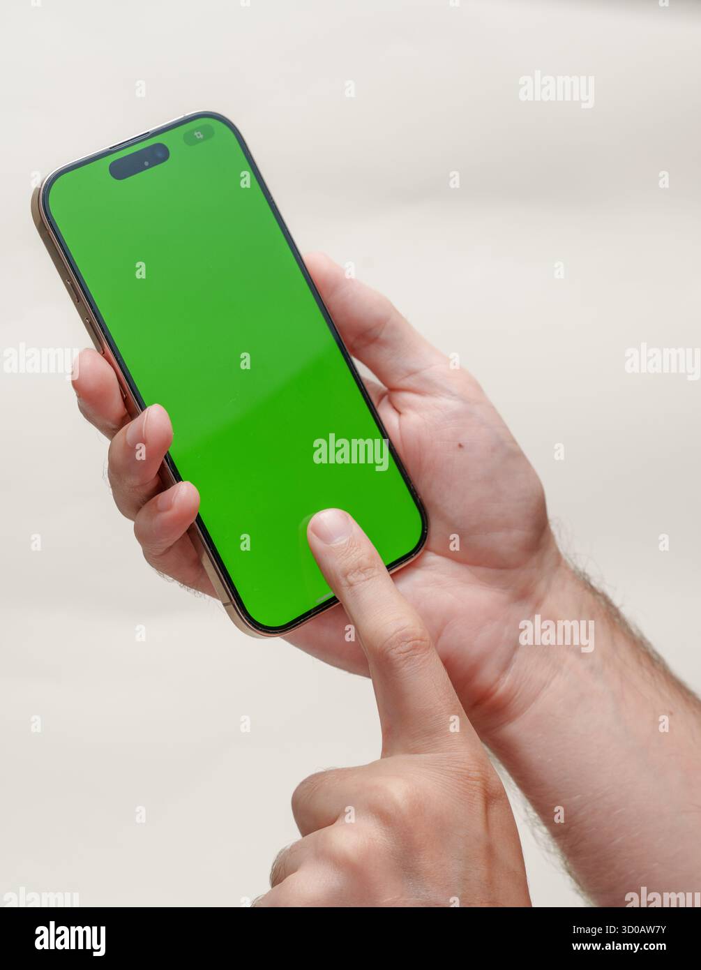 Digital Template: Green Screen Smartphone in Hands Stock Photo