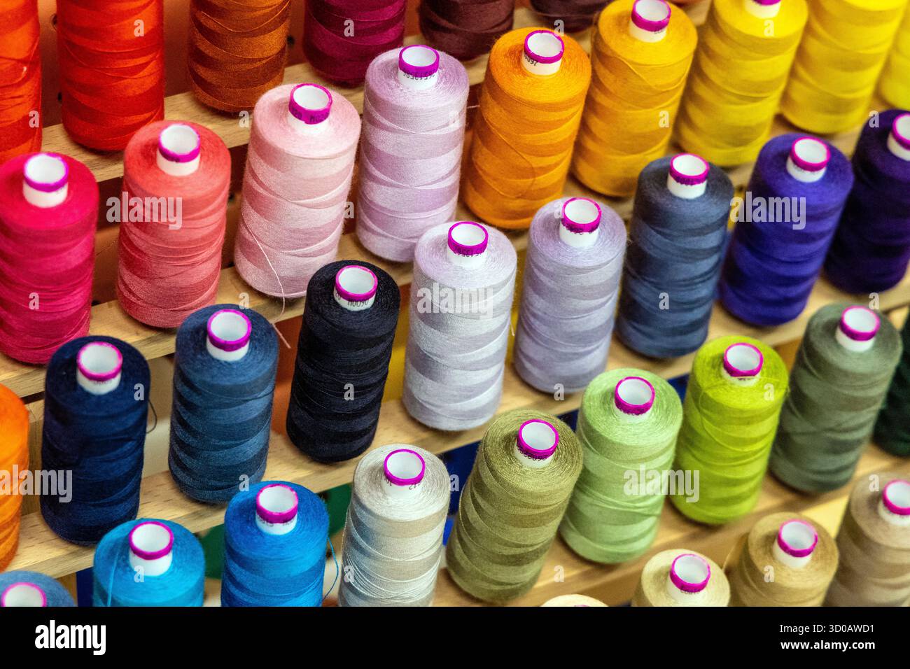 Colourful thread bobbins background Stock Photo