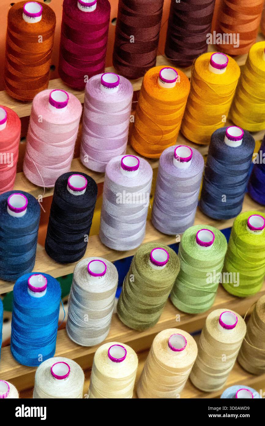 Colourful thread bobbins background Stock Photo
