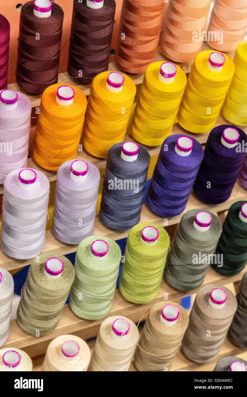 Colourful thread bobbins background Stock Photo
