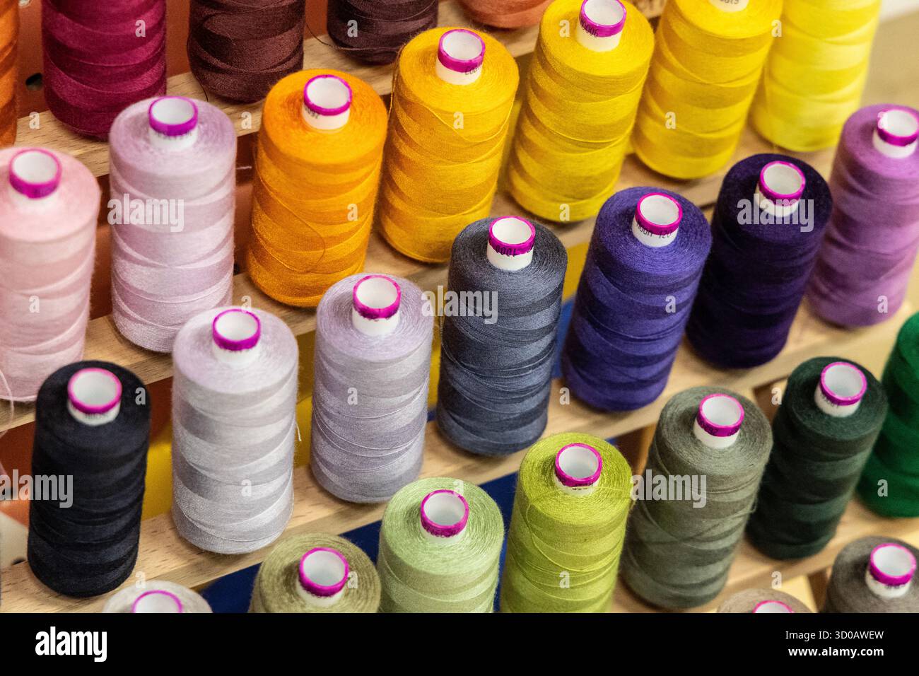 Colourful thread bobbins background Stock Photo