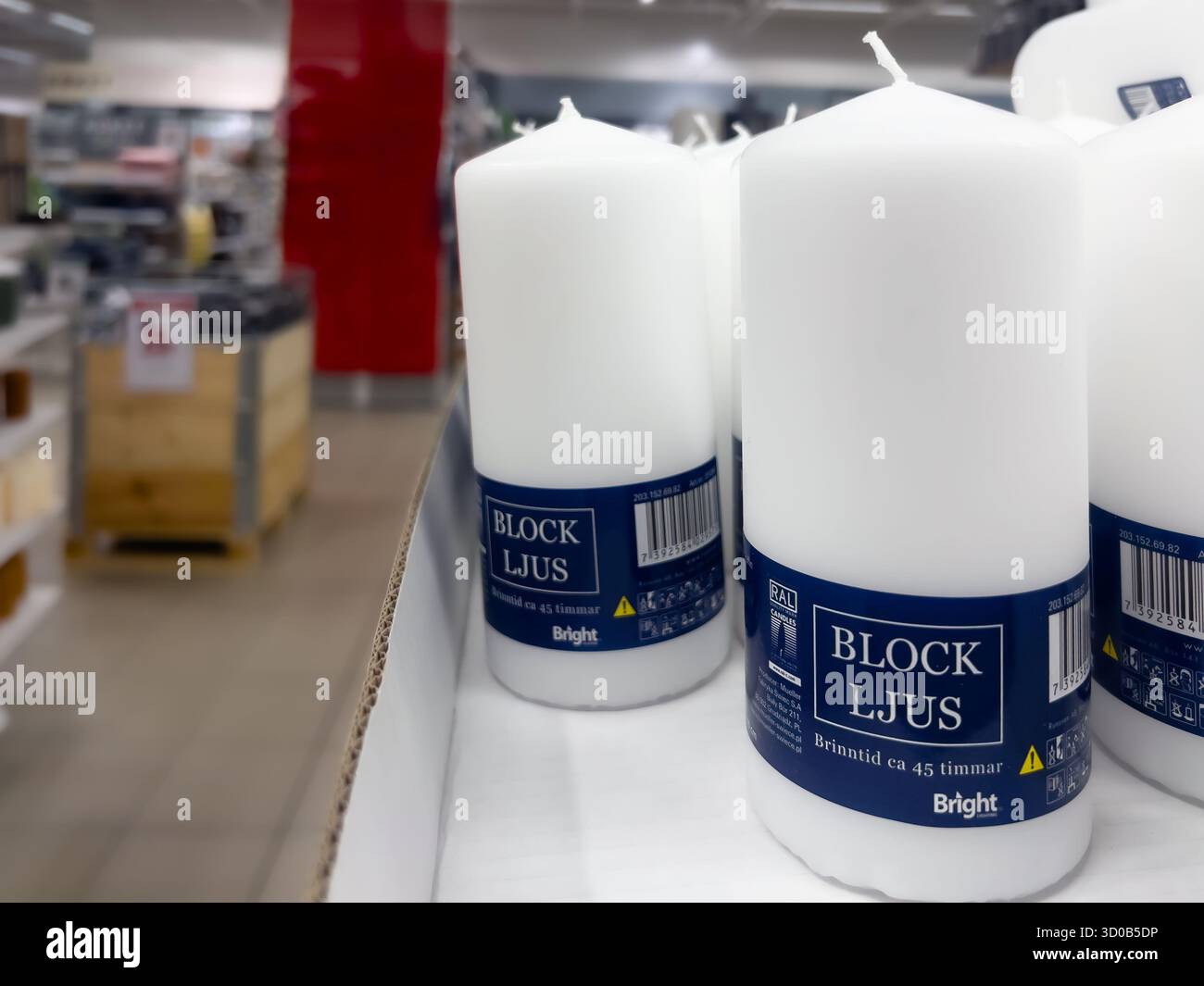 Karlstad, Sweden - October 18, 2025: White block Bright candles are neatly arranged on a shelf in a retail store, highlighting their elegant design an Stock Photo