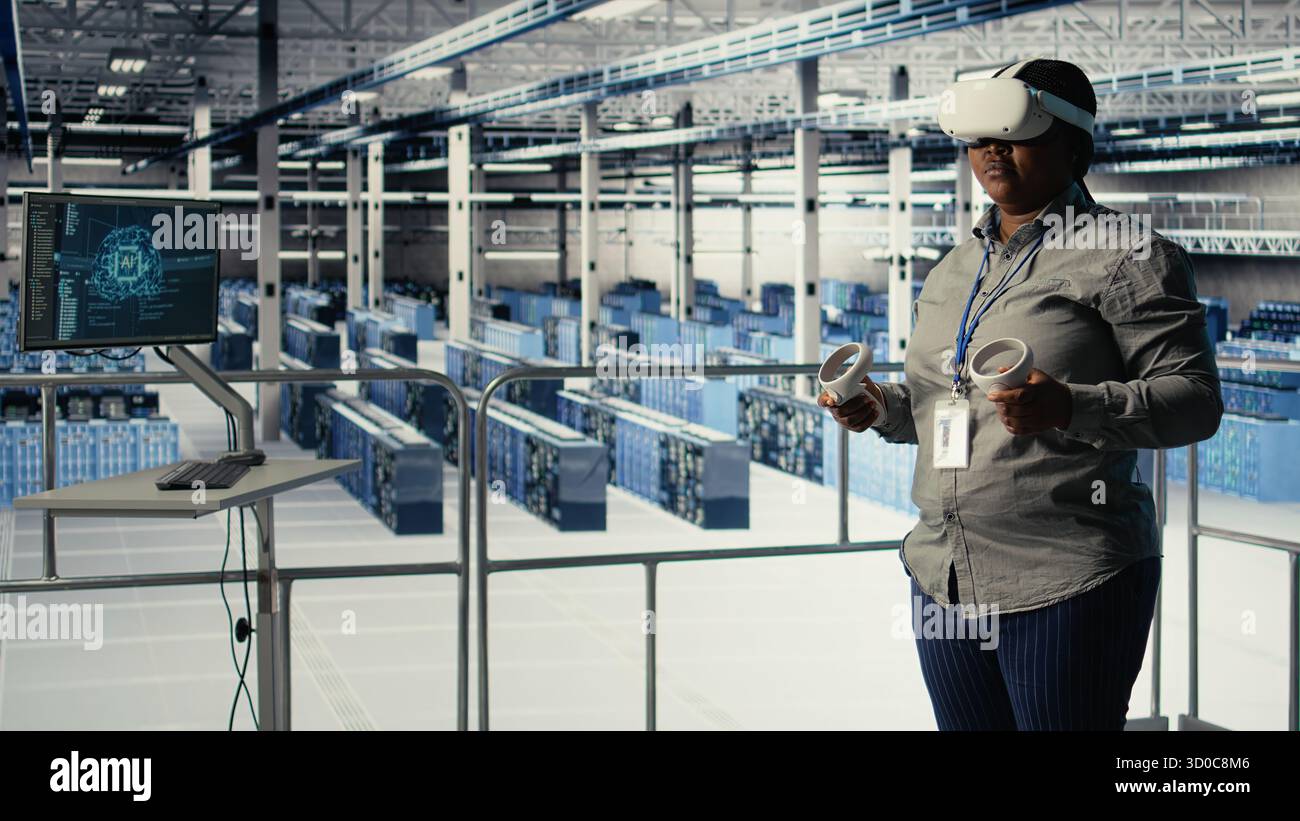 Data center IT expert investigates AI configurations using virtual reality, making adjustments for optimal function. Server hub engineer checks artificial intelligence error using VR headset, camera A Stock Photo