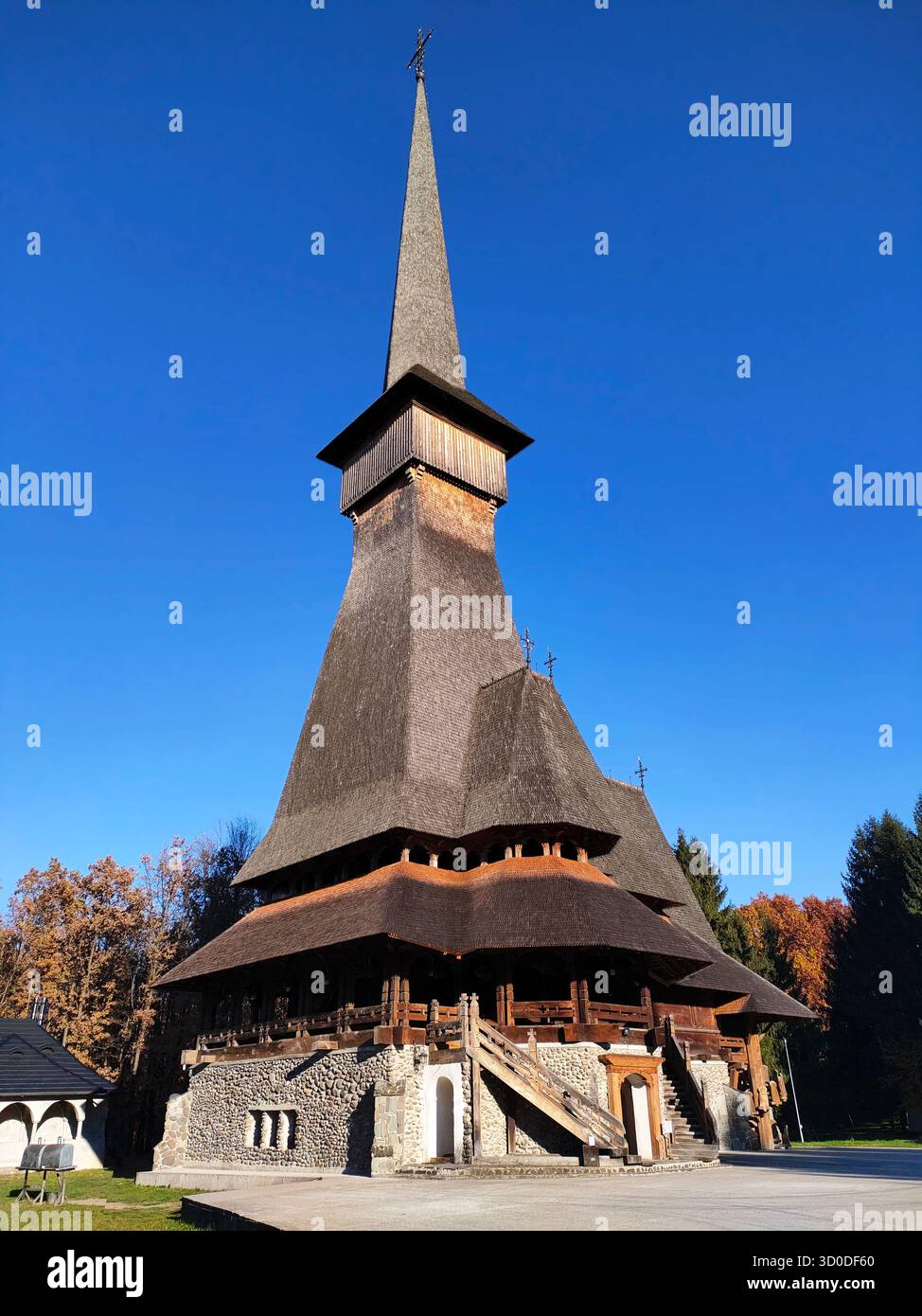 The wooden church of Sapanta Monastery, Maramures county, Romania (Biserica de lemn de la mănăstirea Săpânța Peri, Maramureş, România) - Smartphone Captured Stock Image