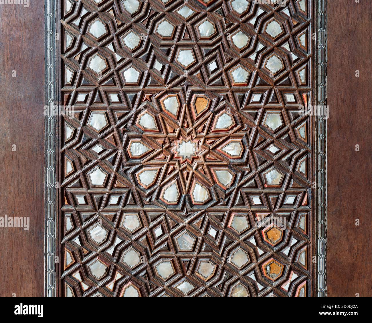 Close-up: Intricate mother-of-pearl inlaid wooden door with Islamic geometric patterns at Muradiye Mosque, Manisa, Turkey Stock Photo