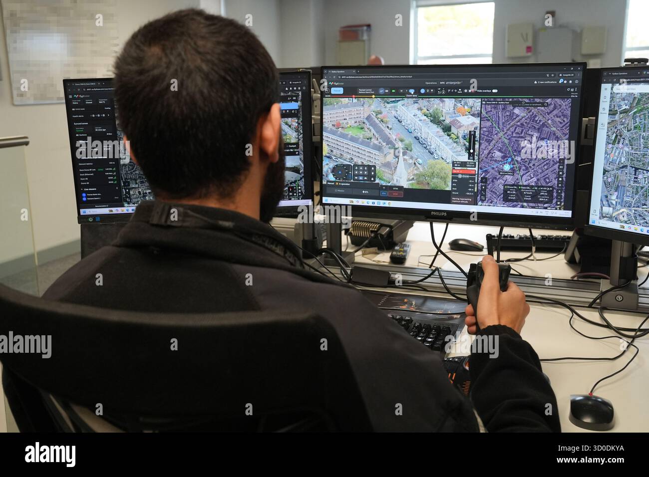 EDITORS NOTE IMAGE PIXELLATED BY PA PICTURE DESK A police officer ...