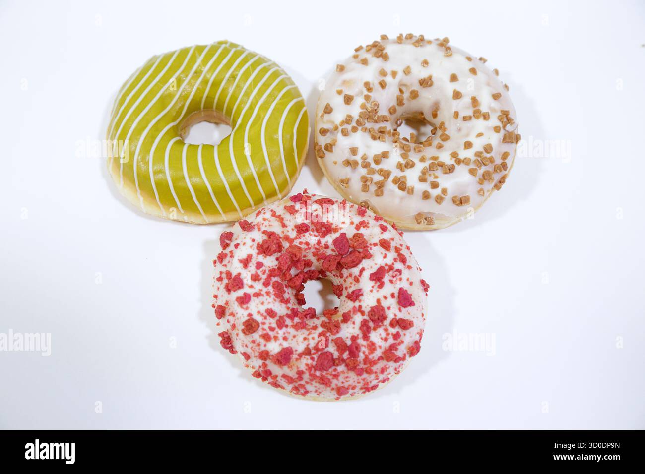 Delicious glazed donuts on white background. Stock Photo