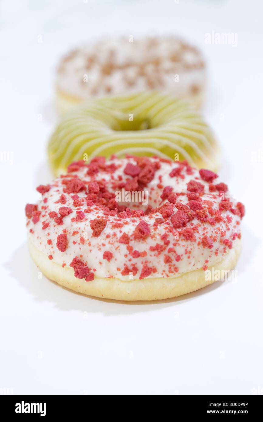 Delicious glazed donuts on white background. Stock Photo