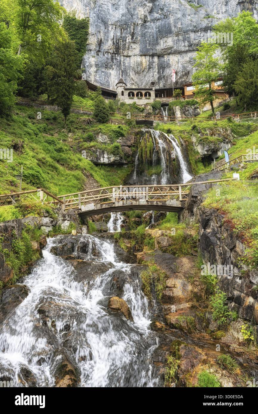 Saint Beatus Cave Entrance And Nearby Waterfall Taken In Interlaken saint-beatus-cave-entrance-and-nearby-waterfall-taken-in-interlaken
