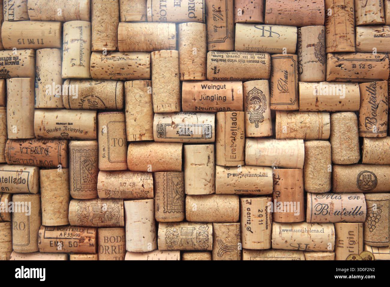 Corks from wine bottles laid out in a regular pattern, wine corks, red wine Stock Photo