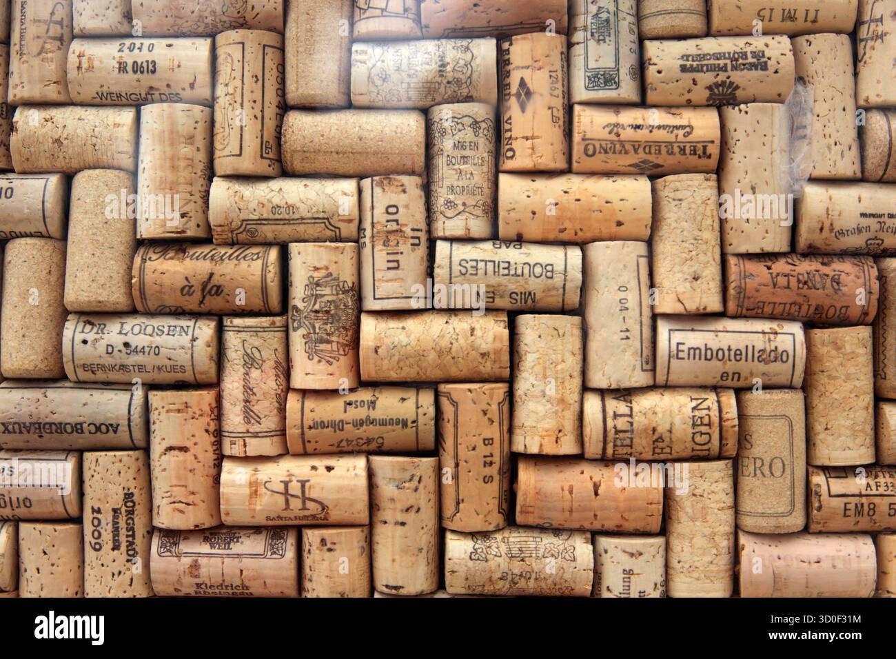 Corks from wine bottles laid out in a regular pattern, wine corks, red wine Stock Photo