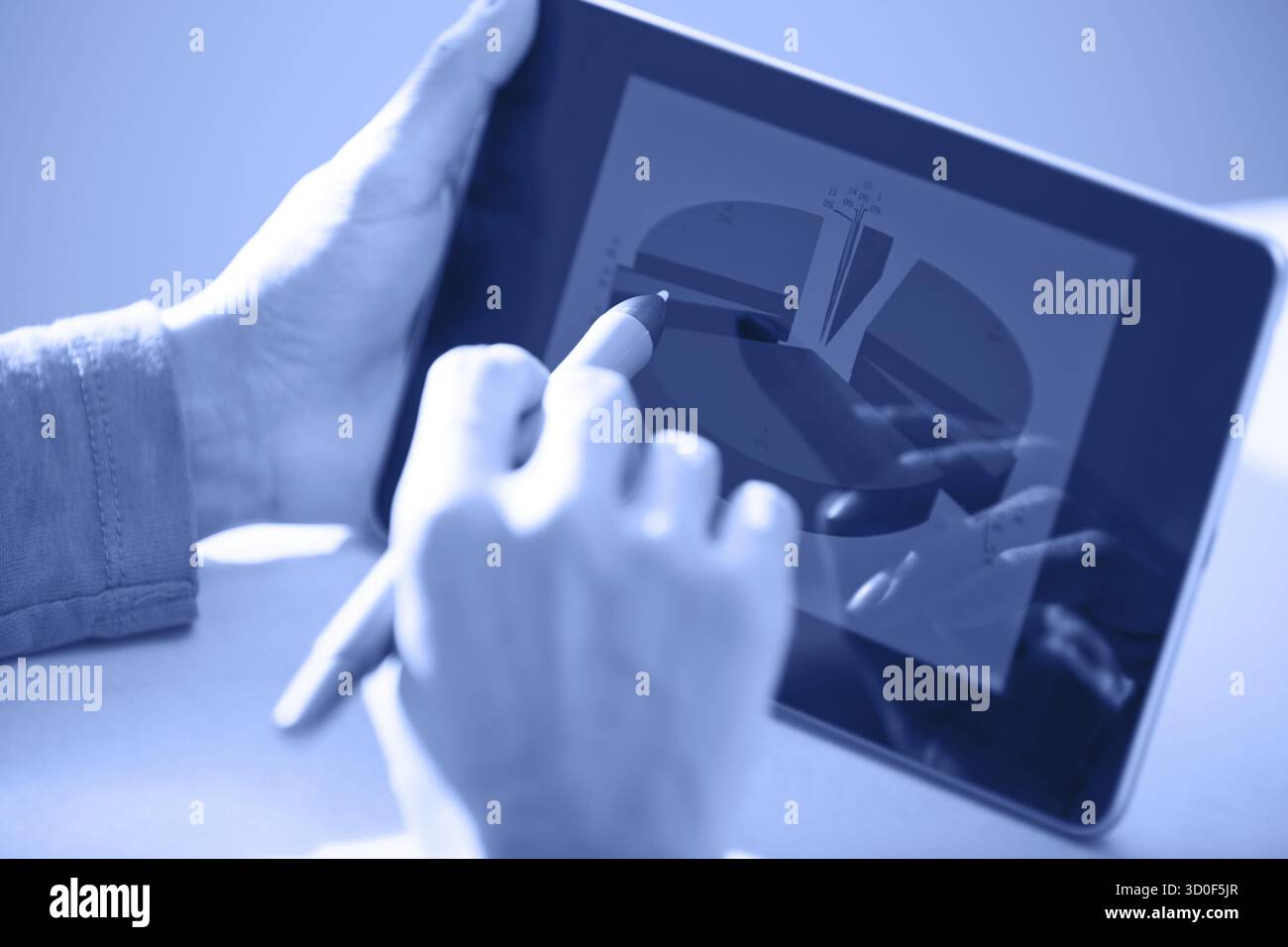 Human hands using tablet PC and sylus for diagram working. Diagram was ...