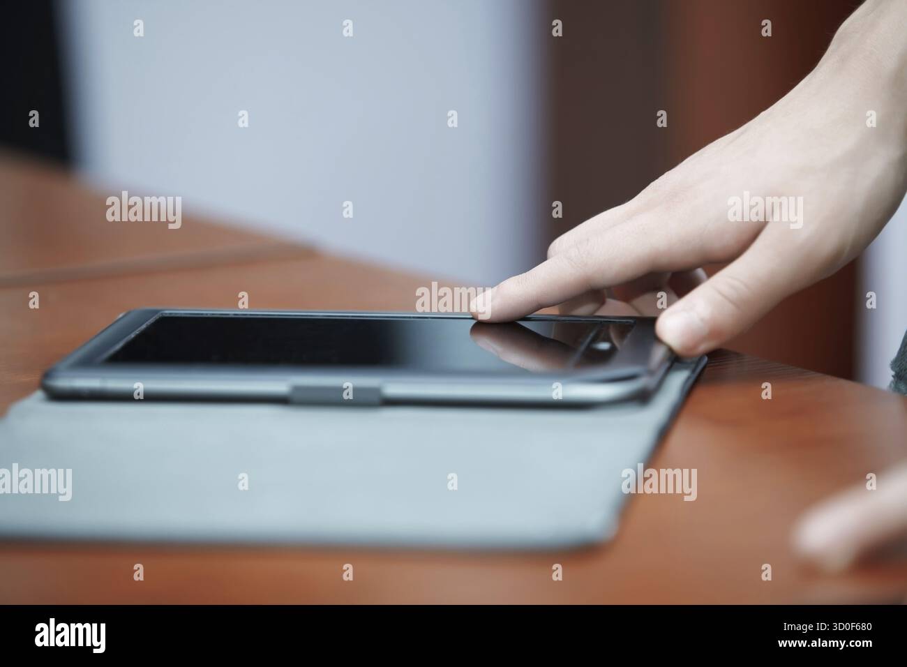 Human hand using tablet computer Stock Photo