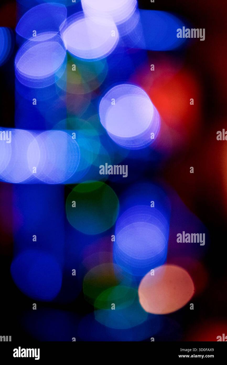 new year lights bokeh background. defocused abstract christmas decorations. blurred garland for festive mood. technological winter holidays. shimmerin Stock Photo
