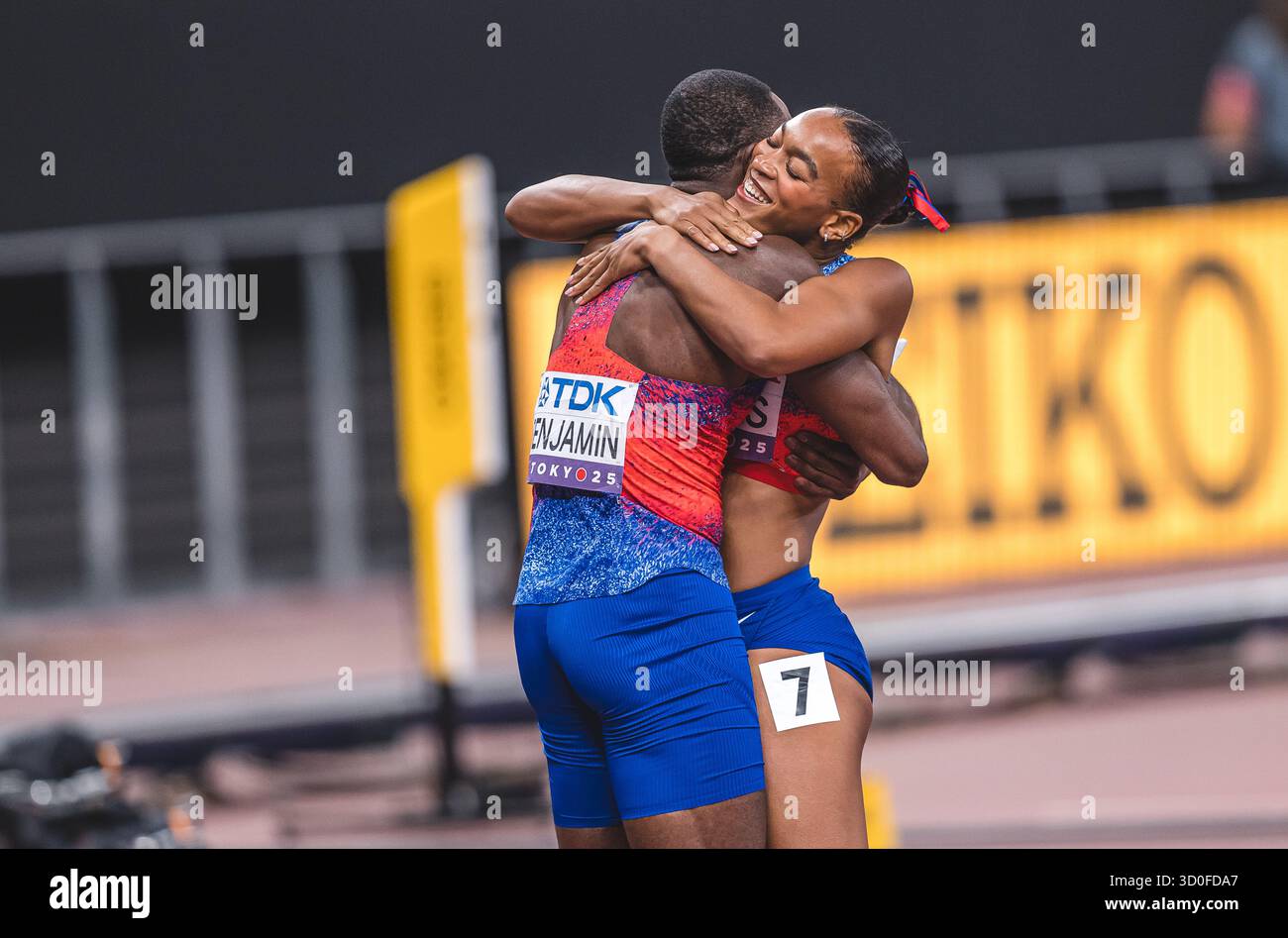 Jasmine Jones and Rai Benjamin hugging and celebrating her medal with ...