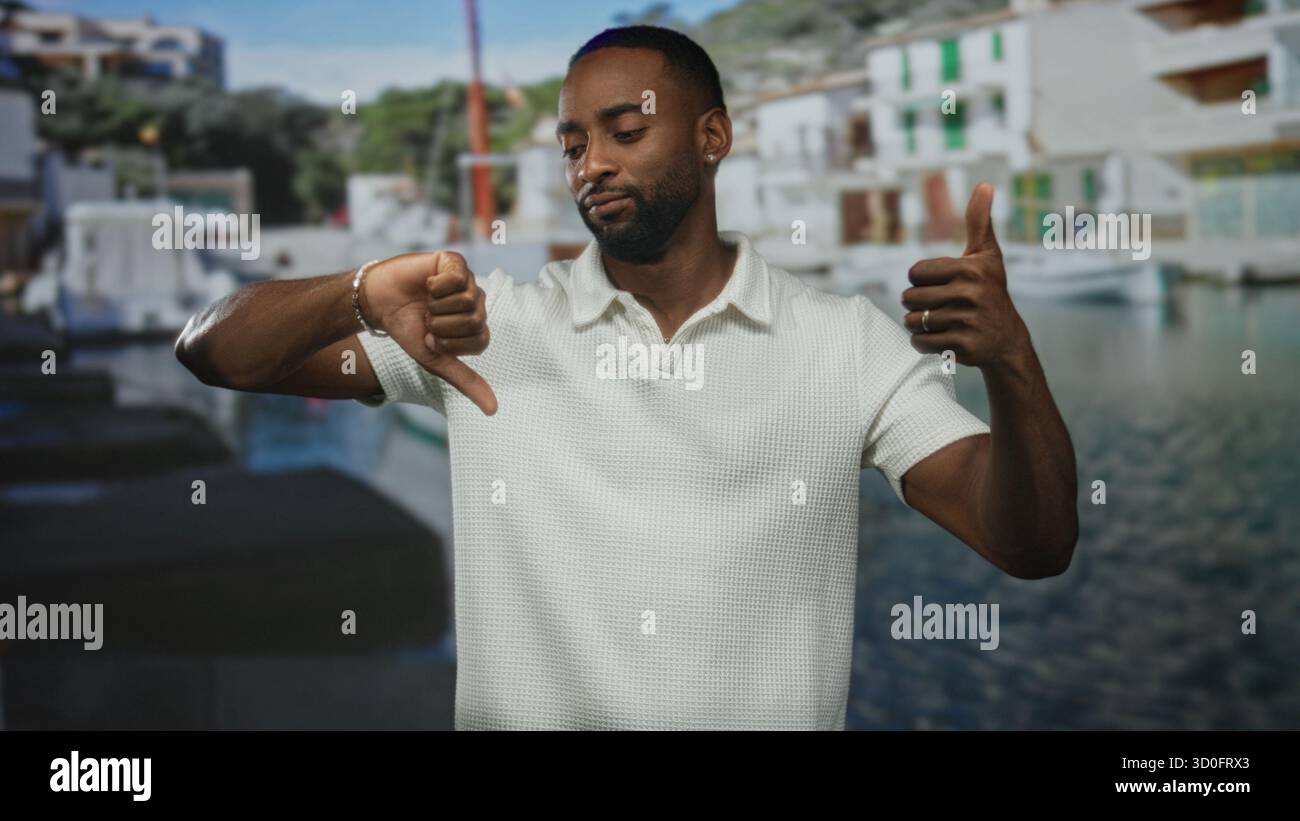 Man wearing white polo showing thumbs up and thumbs down at a street ...