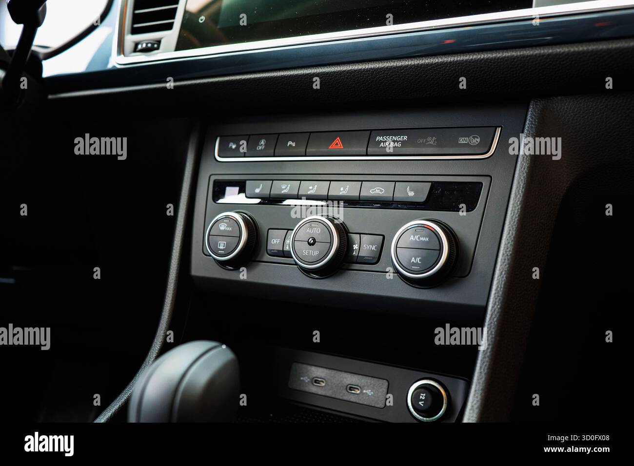 New car climate control panel with plastic knobs, buttons and dials. Close up shot, no people Stock Photo