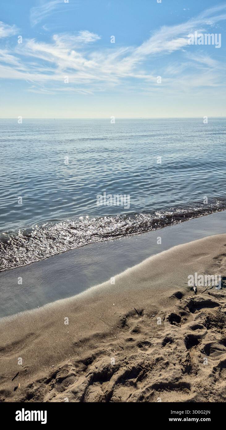 Adriatic Sea at sunrise in Italy, calm shining water and peaceful coastal landscape. - Smartphone Captured Stock Image