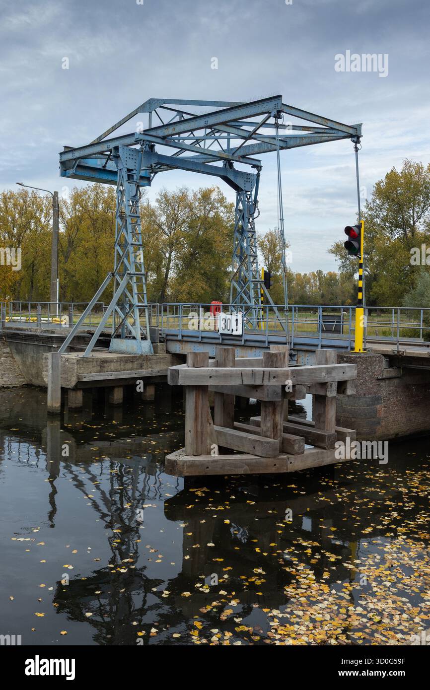 Autumn view of the historic lift bridge at Zandbergen near Geraardsbergen, in East Flanders, Belgium. Copy space below. - Stock Image