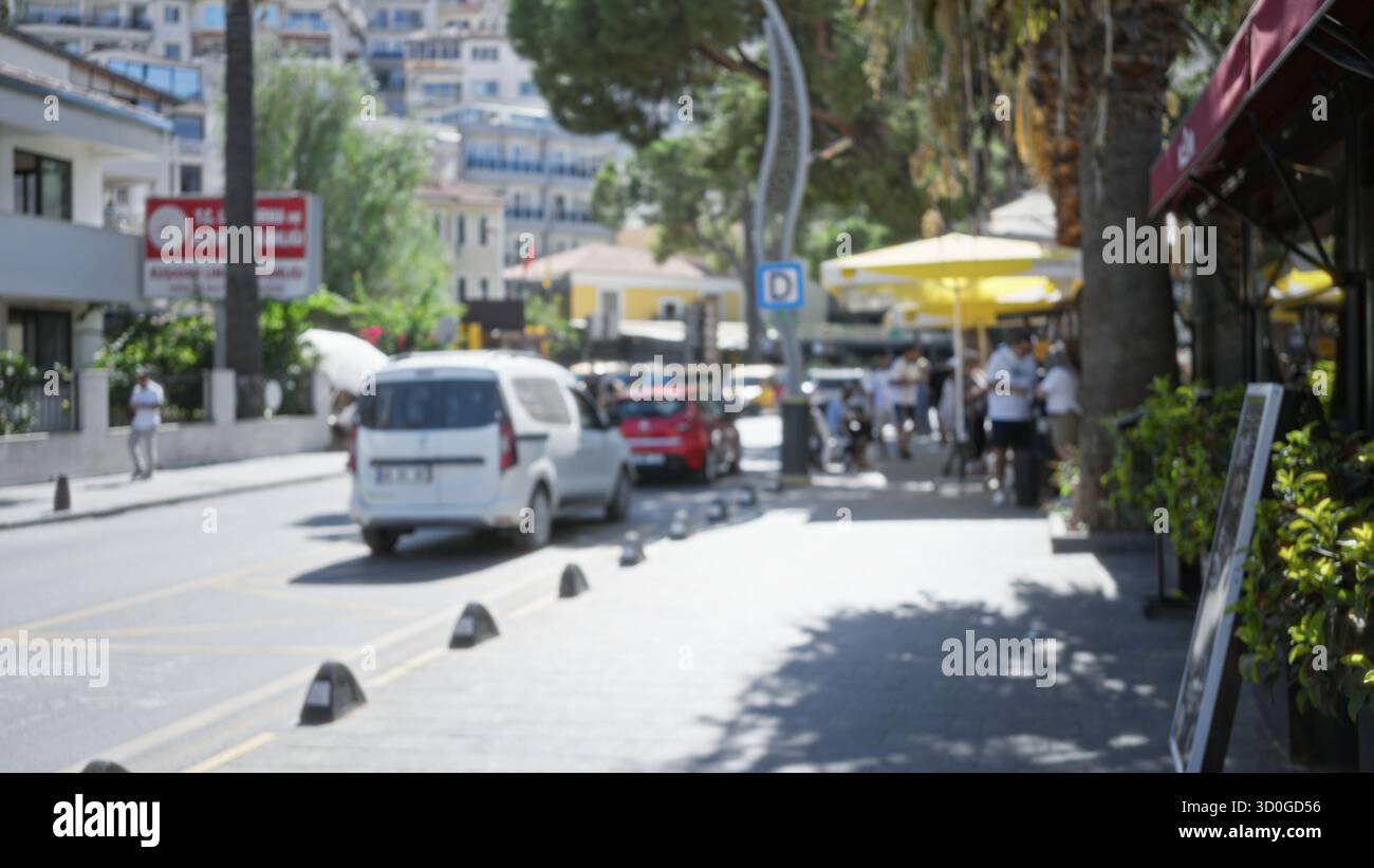 Sunlit urban street scene with soft shallow bokeh and defocused ...