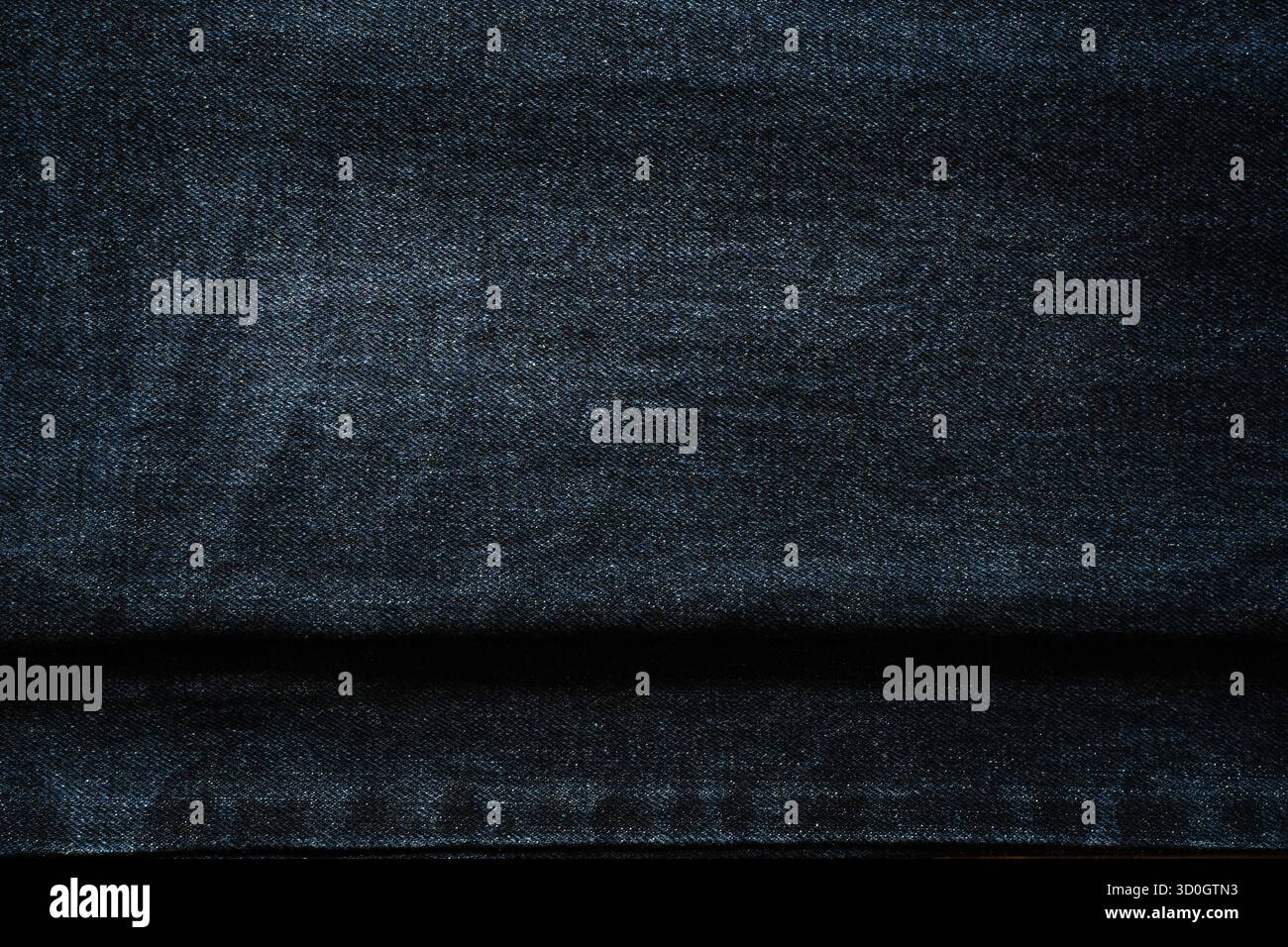 Layers of dark blue jeans texture Stock Photo