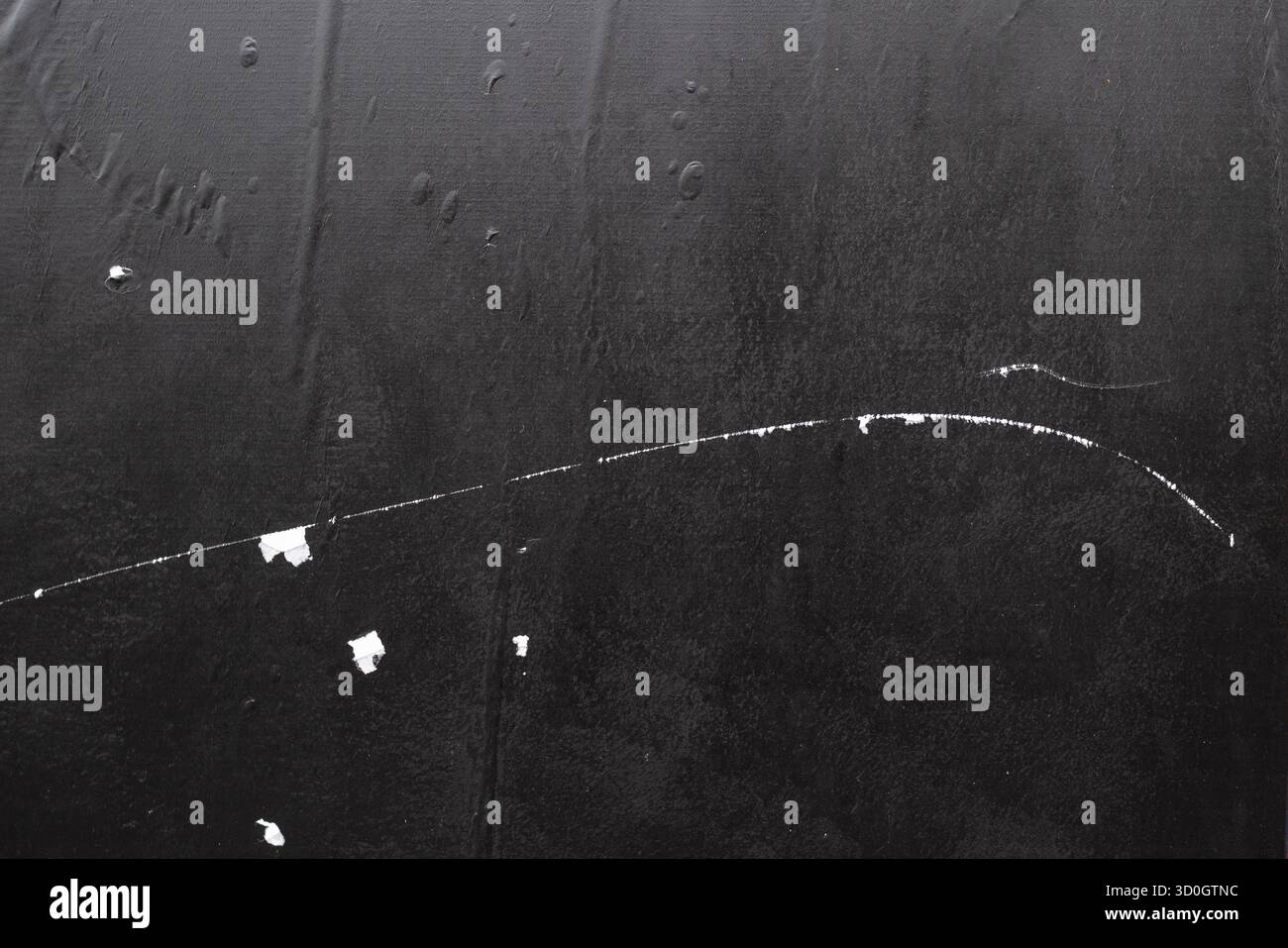 Black wheatpaste street poster with crease lines and white scratch marks texture Stock Photo