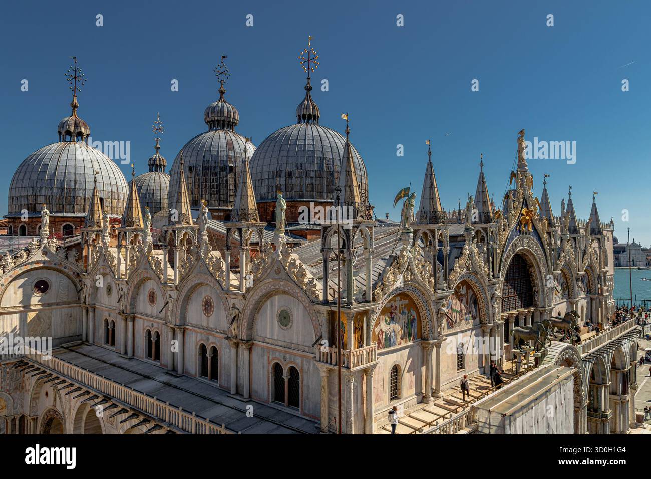 The Byzantine domes of St Mark's Basilica, seen from The Clock tower on the North Side of Piazza San Marco,Venice,Italy Stock Photo