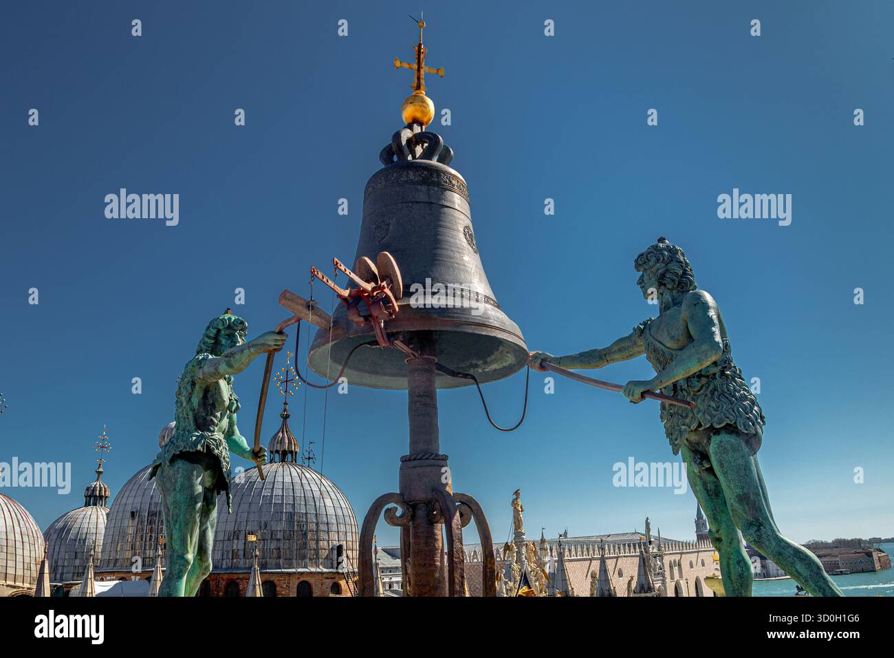 Two statues in bronze, known as The Moors, striking the bell on top of ...