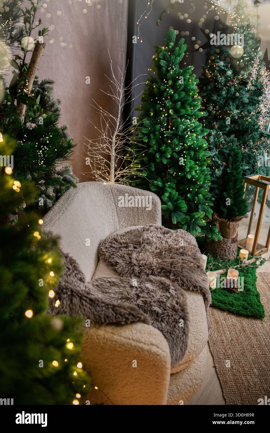 christmas indoor decoration with christmas tree and warm bokeh lights Stock Photo