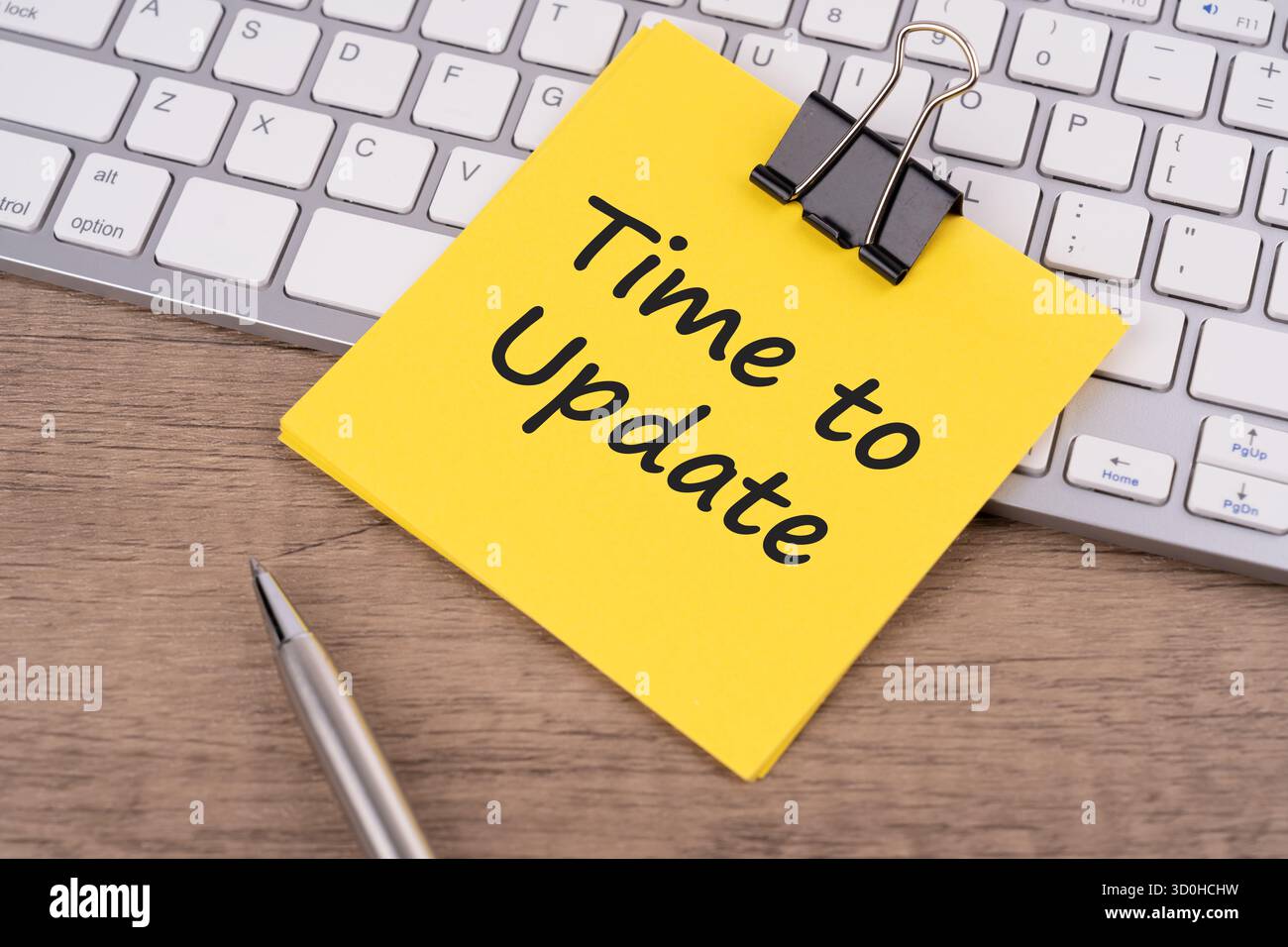Time to update text on adhesive note - business concept Stock Photo