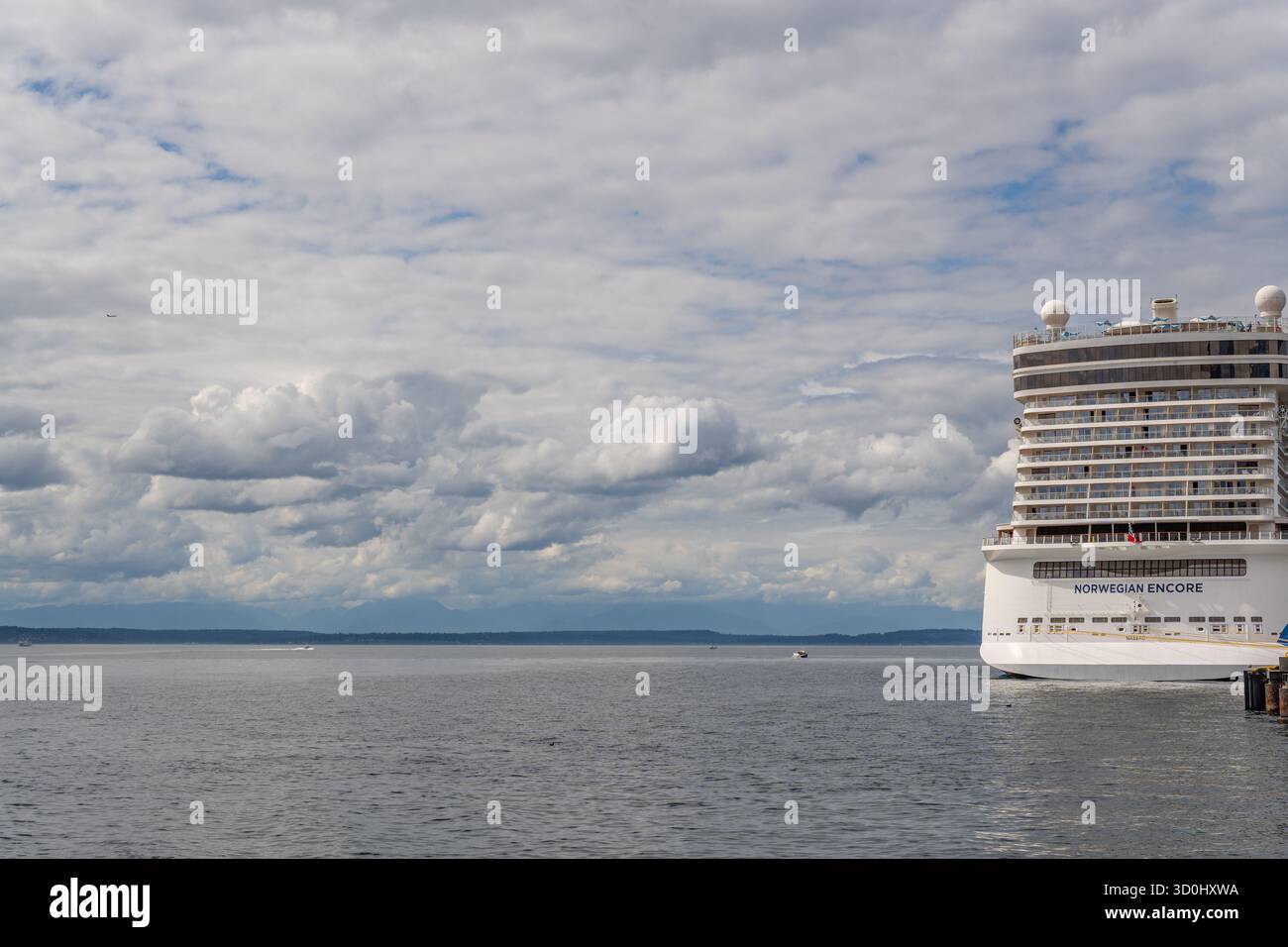 Seattle, WA, USA-August 17, 2025: Seattle's vibrant newly renovated waterfront district with docked cruise ship. Stock Photo