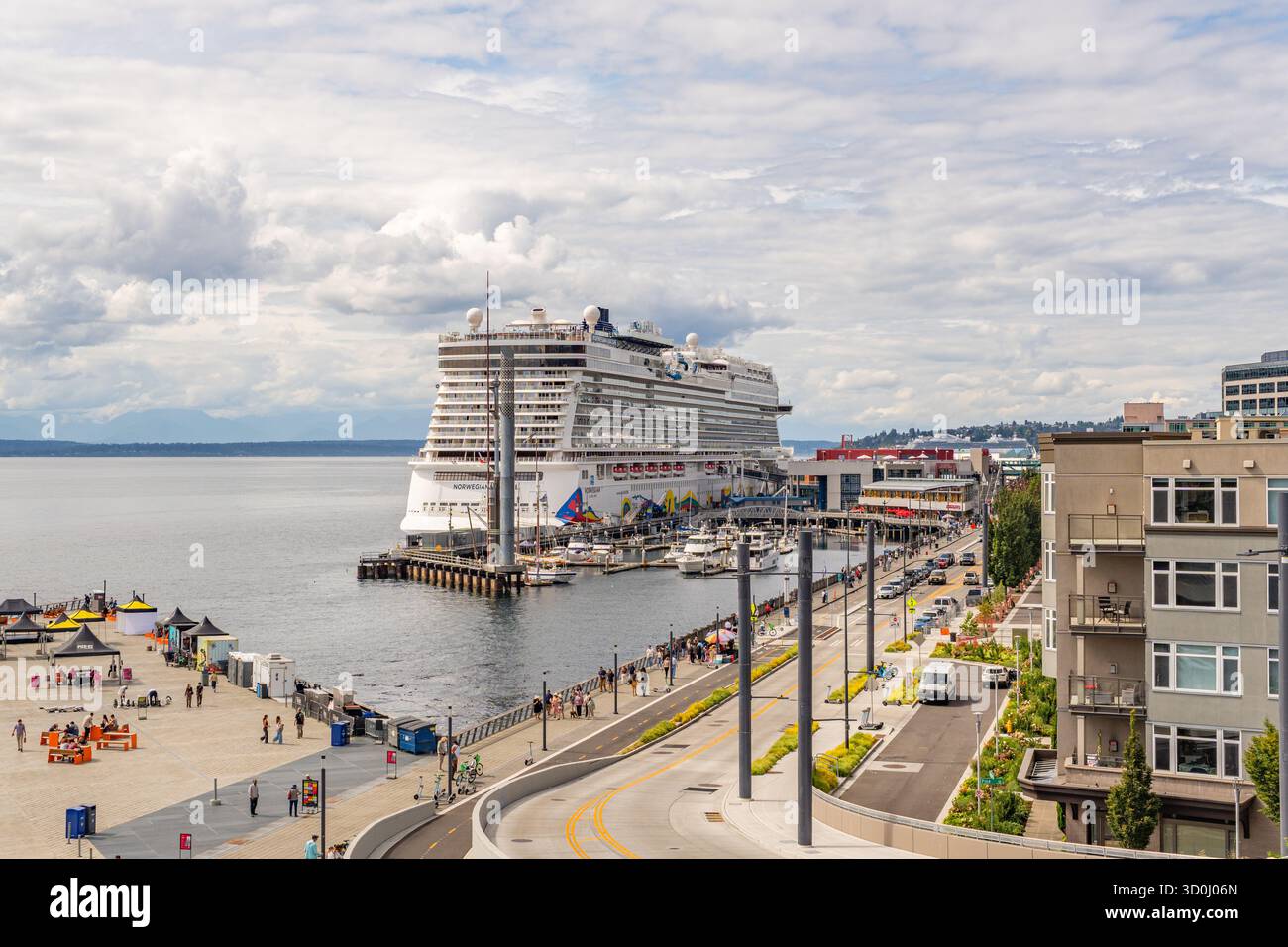 Seattle, WA, USA-August 17, 2025: Seattle's vibrant newly renovated waterfront district with docked cruise ship. Stock Photo