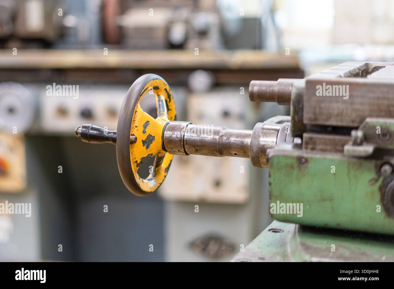 Old worn out milling machine control panel and control dial in a workshop Stock Photo