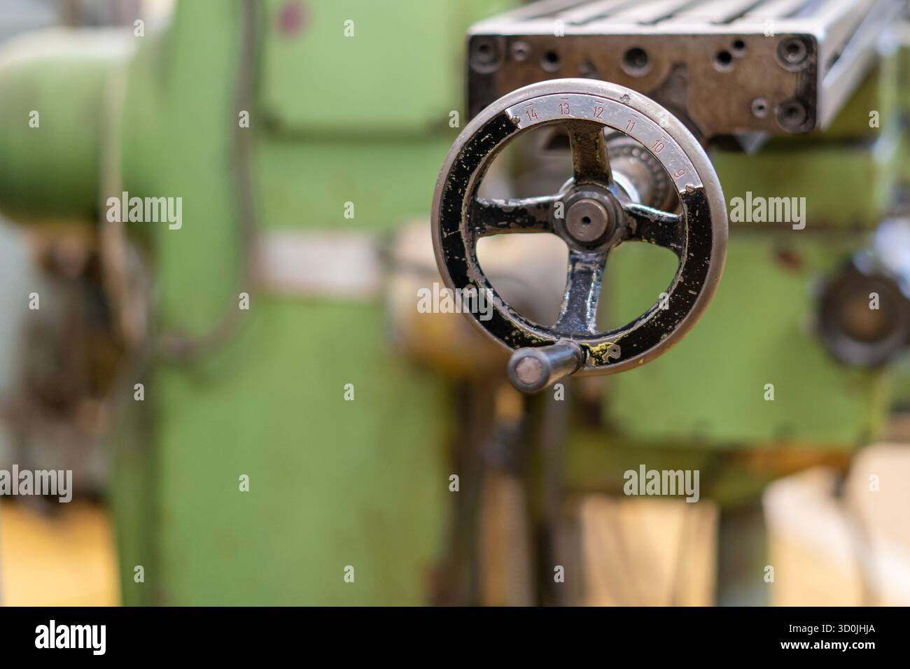Old worn out milling machine control panel and control dial in a workshop Stock Photo