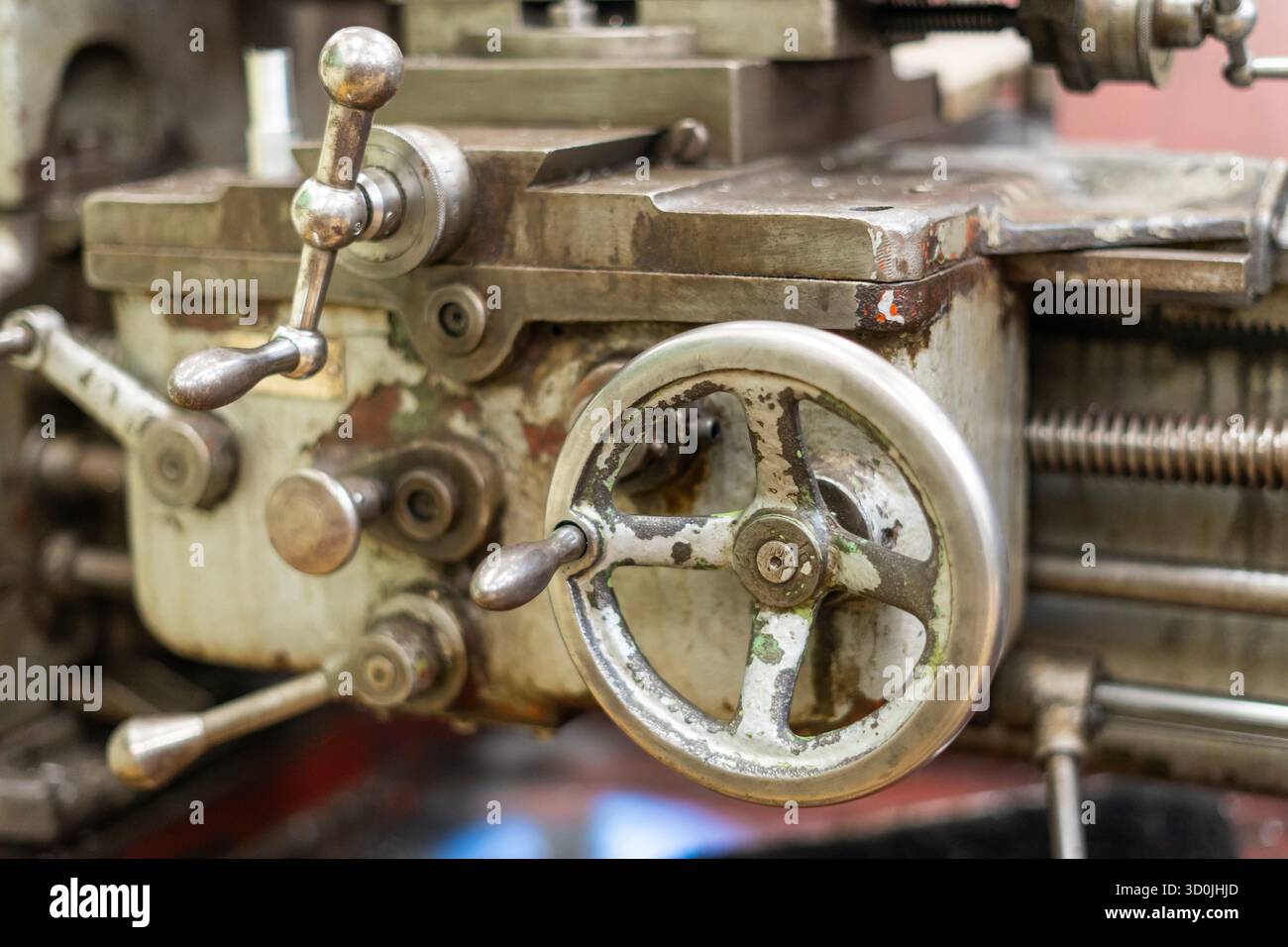 Old worn out milling machine control panel and control dial in a workshop Stock Photo