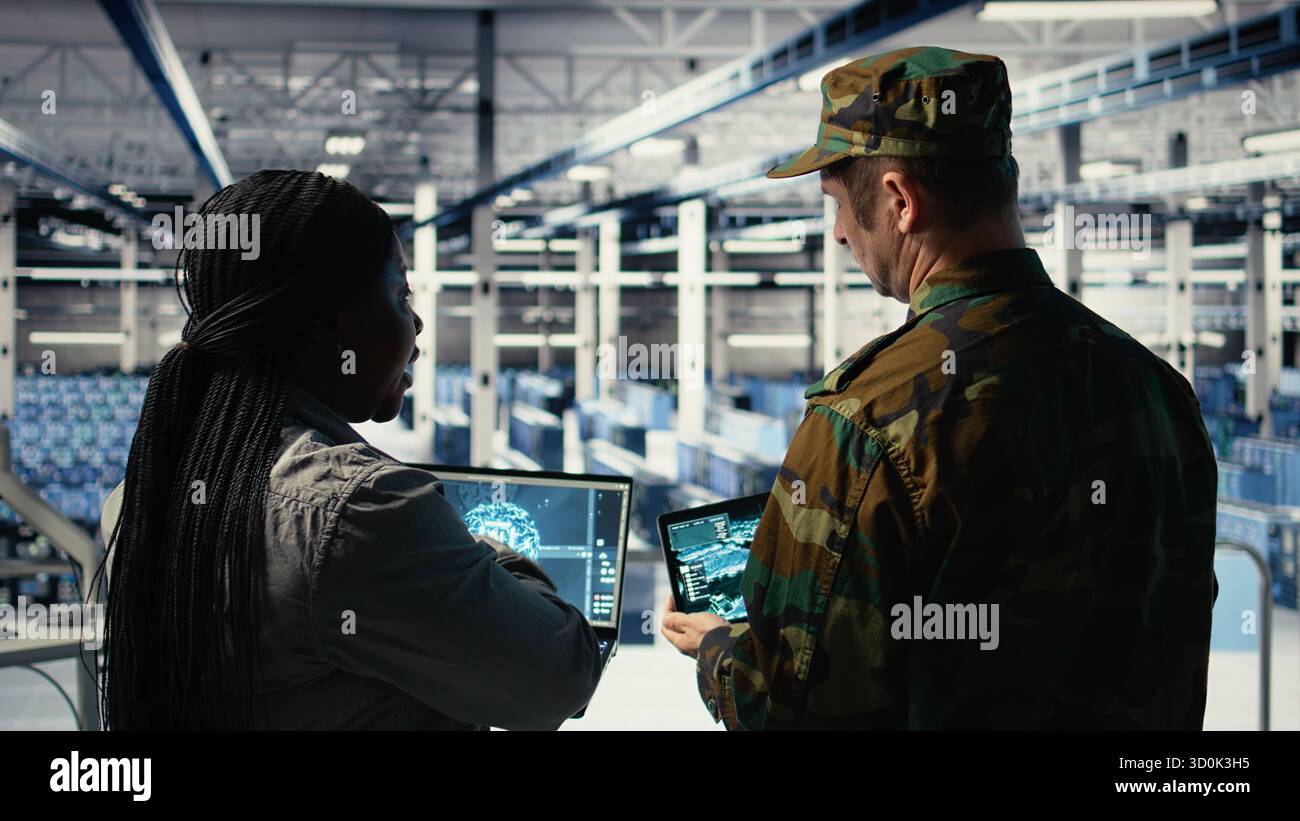 Army commander and software developer in data center integrating AI ...