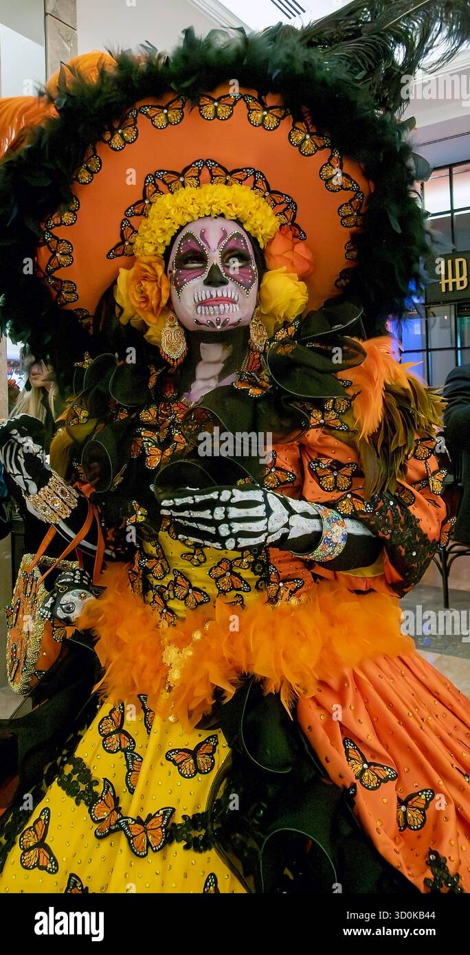 A woman with face paint and costume parades in the week leading up to Mexico's Days of the Dead Stock Photo