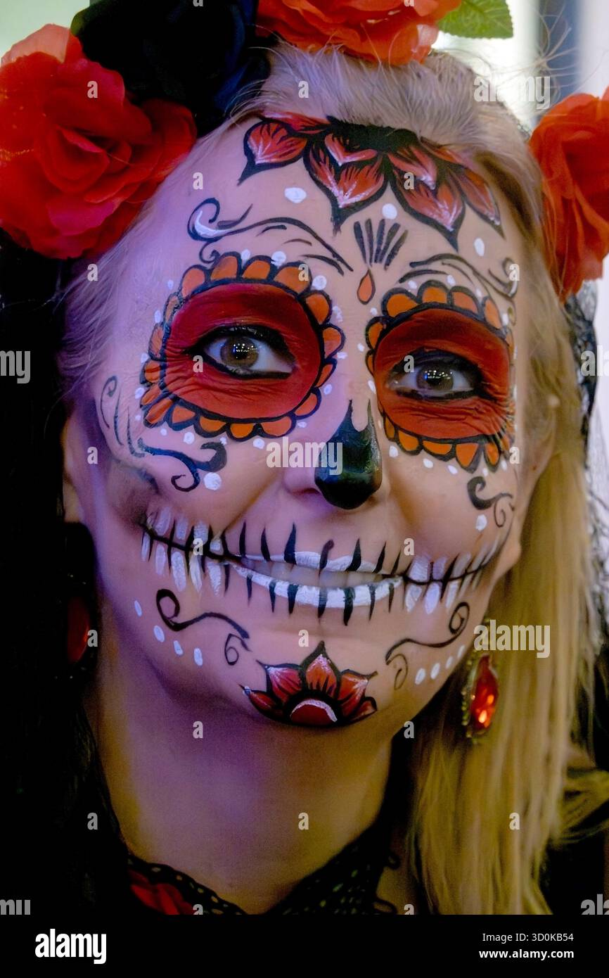 Woman with face painted for the Day of the Dead in Mexico Stock Photo