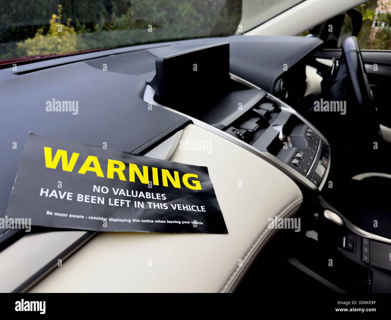 Hampshire England UK.  28.10. 2023. Theft prevention  notice placed on the interior of a luxury car - Stock Image