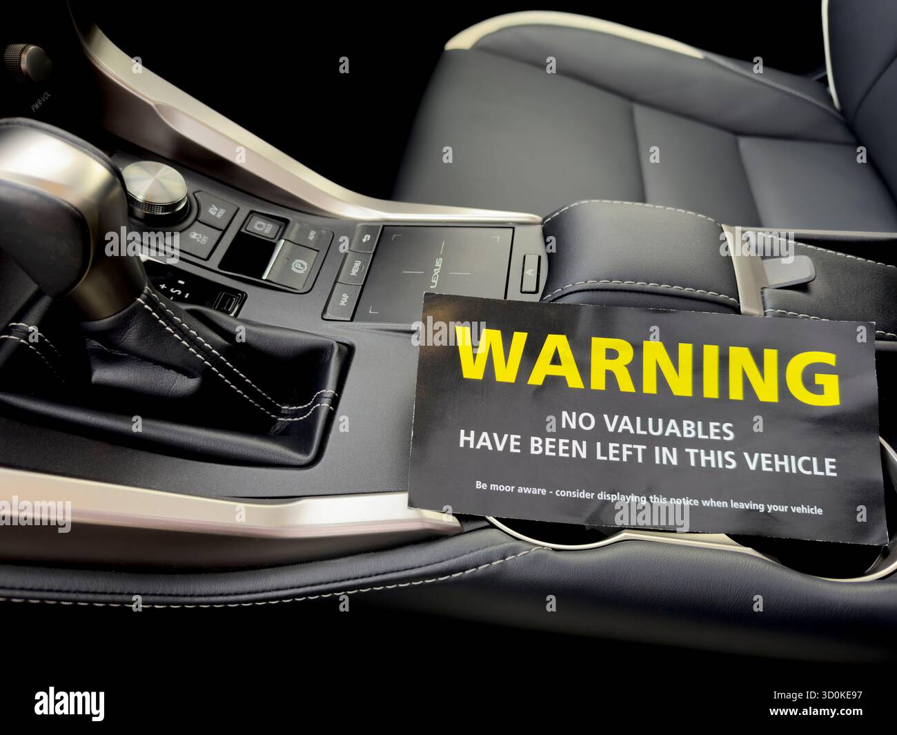 Hampshire England UK.  28.10. 2023. Theft prevention notice placed on the interior of a luxury car - Stock Image